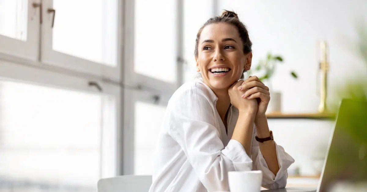 Smiling woman relaxing during a consultation.